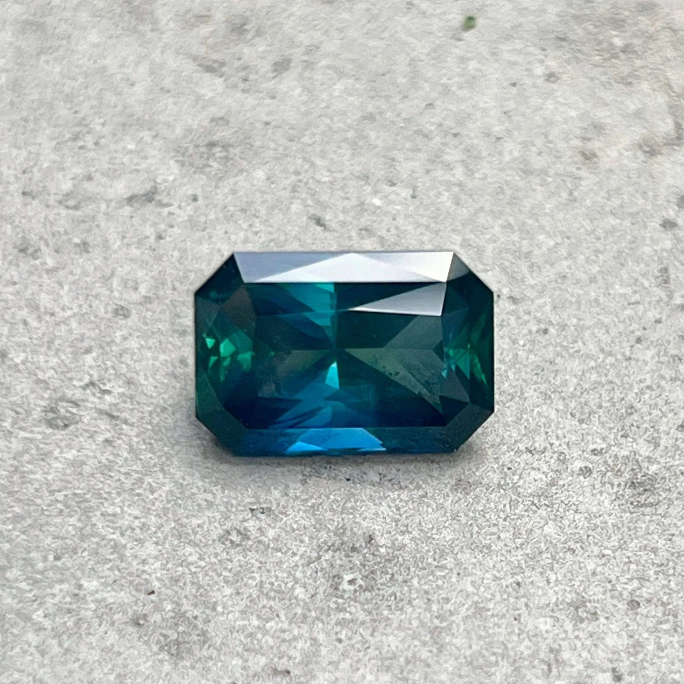 6.60CT RADIANT CUT MADAGASCAR SAPPHIRE, DEEP GREEN TEAL WITH FLASHES OF ROYAL BLUE , 12.70X8.55X6.16MM