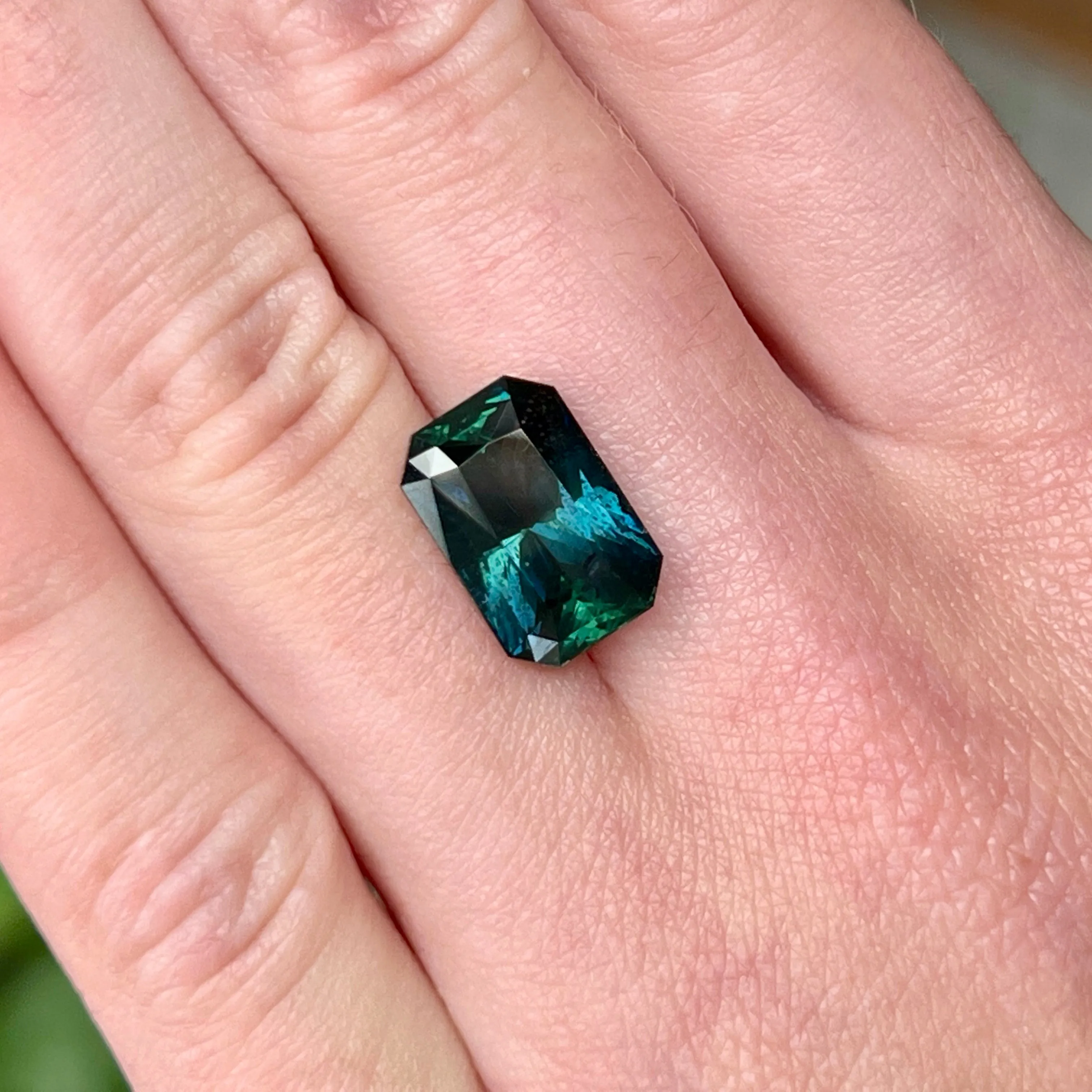 6.60CT RADIANT CUT MADAGASCAR SAPPHIRE, DEEP GREEN TEAL WITH FLASHES OF ROYAL BLUE , 12.70X8.55X6.16MM